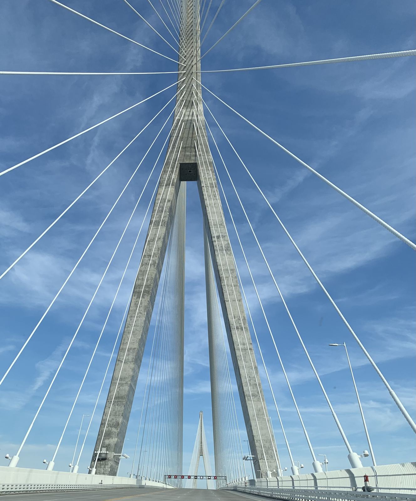 Pylon of the Gordie Howe International Bridge, seen from the road looking up